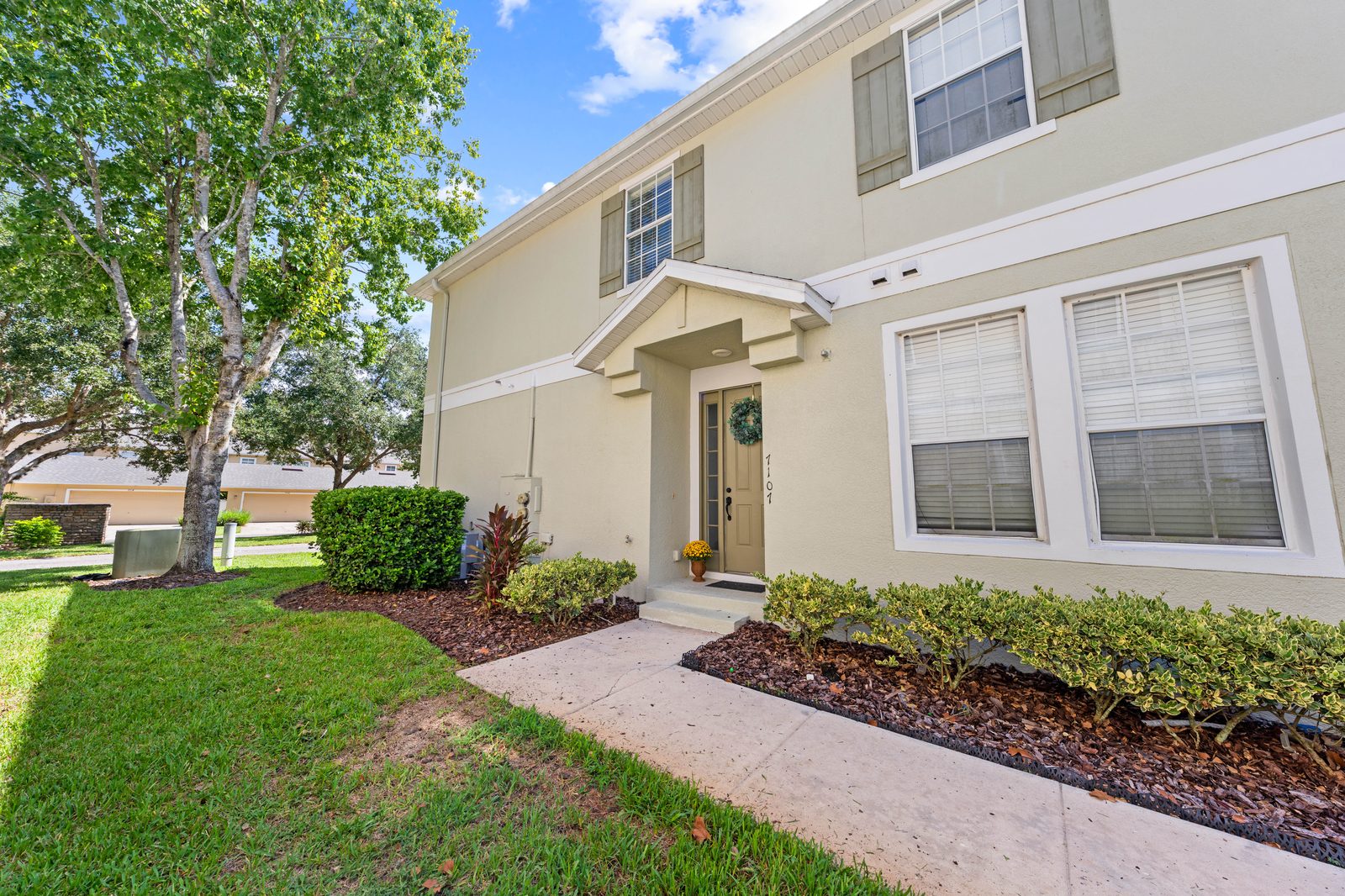 Front entry of the end-unit condo at 7107 Red Lantern Drive