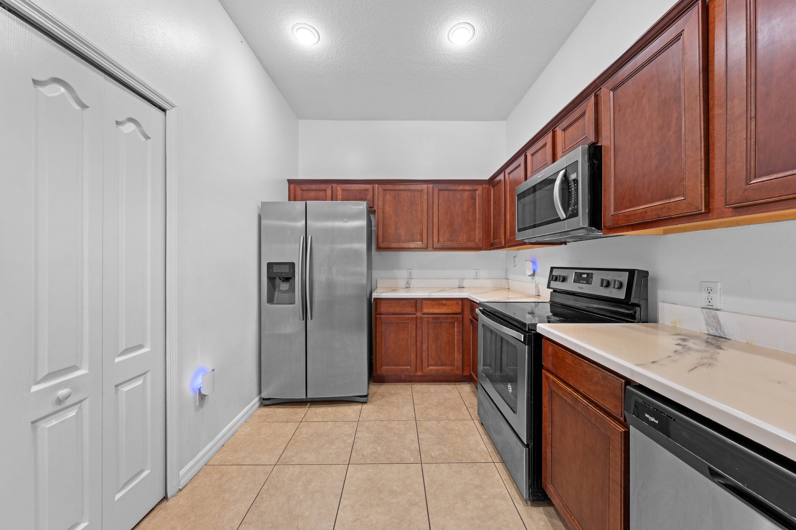 Kitchen range, microwave, and refrigerator