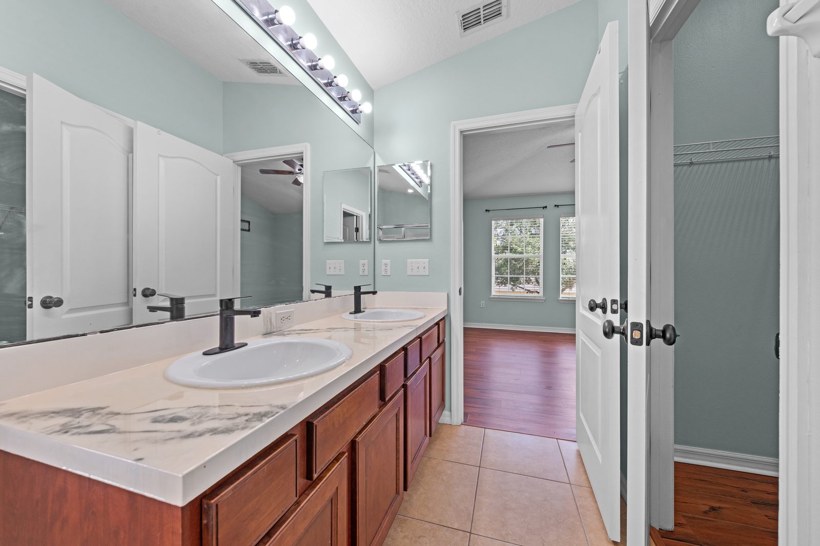 Primary bathroom double vanity and doorway