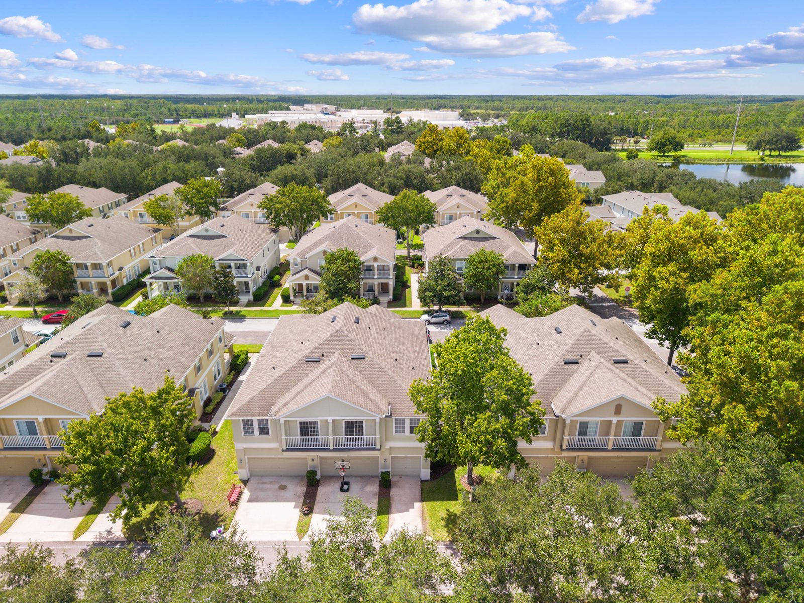 Aerial view of the condo building and surrounding street